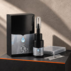 Chipmend windshield repair kit: black box, resin bottle with clear cap, clear film squares and a razor blade on a dark counter